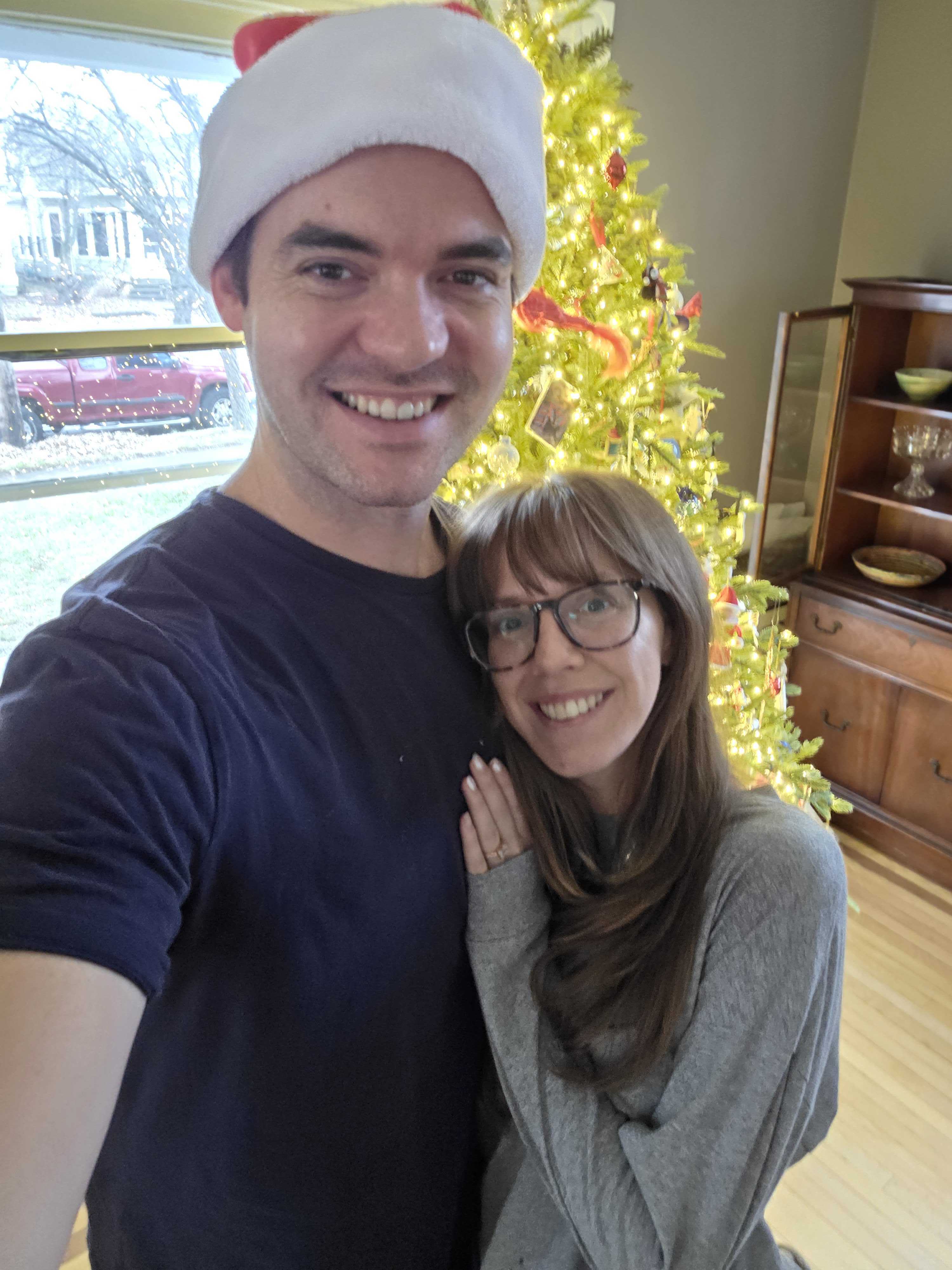 Danny and Bailey together beside a Christmas tree