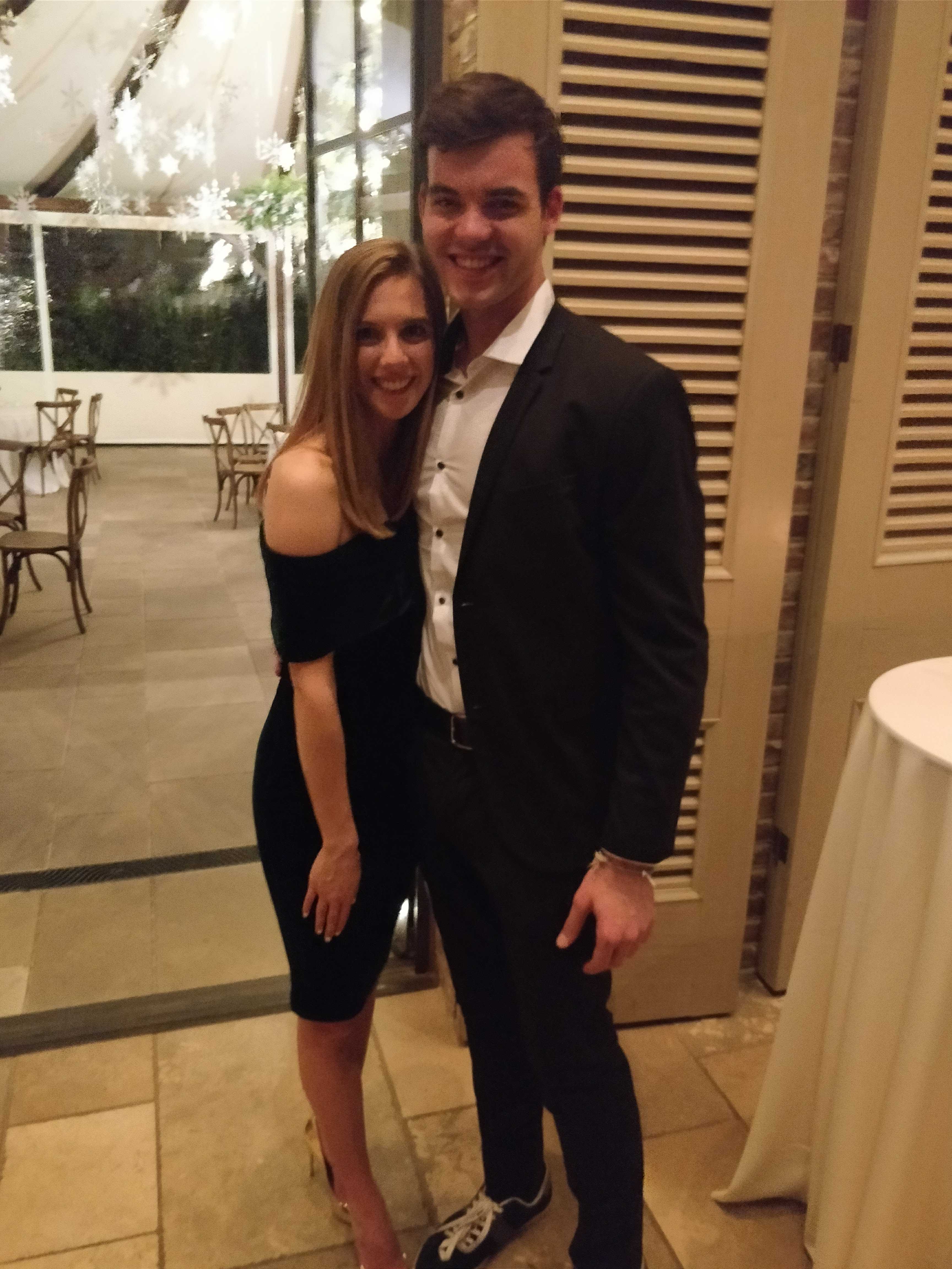 Danny and Bailey dressed up together indoors